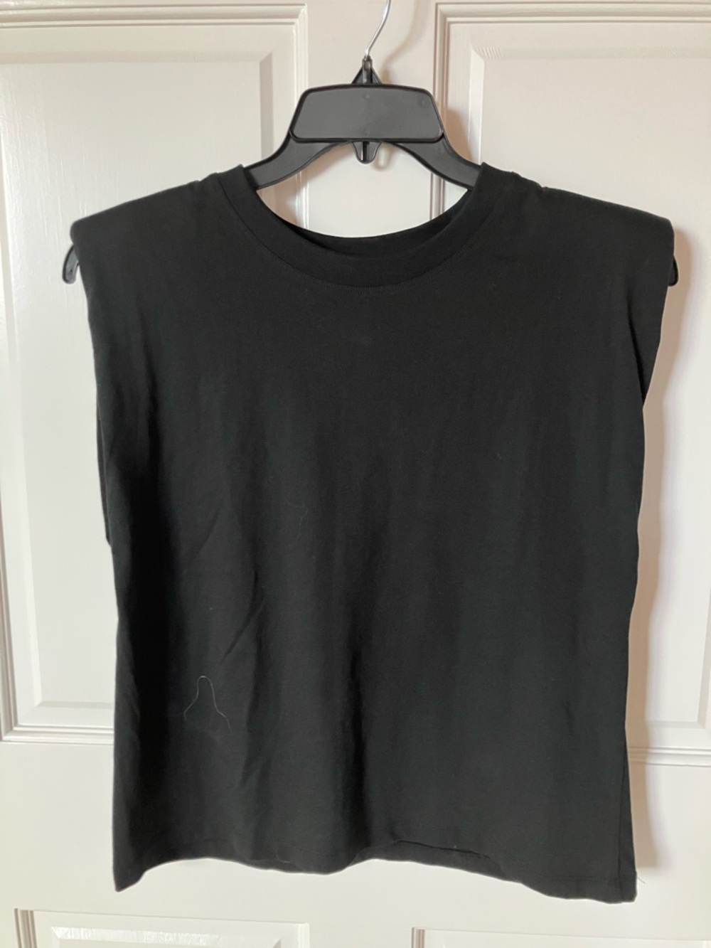 Zara sleeveless crew neck padded shoulder.